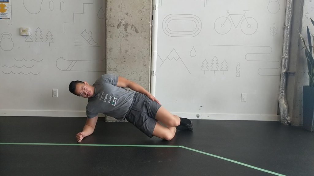 Side Bridge: A great way to integrate your Quadratus Lumborum (QL) muscles to work with your abdominal wall. Example by Lift Clinic Vancouver Physiotherapist Henry
