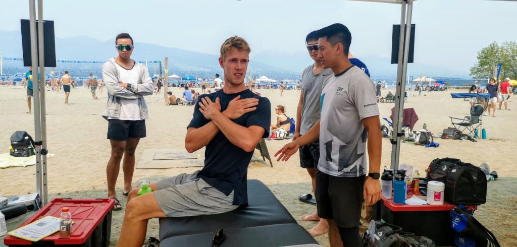 beach volleyball athlete during shoulder assessment