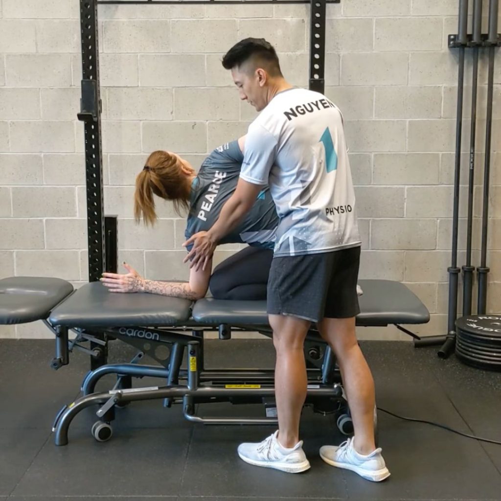 Assessing mobility when moving your arm behind your back Lift Clinic