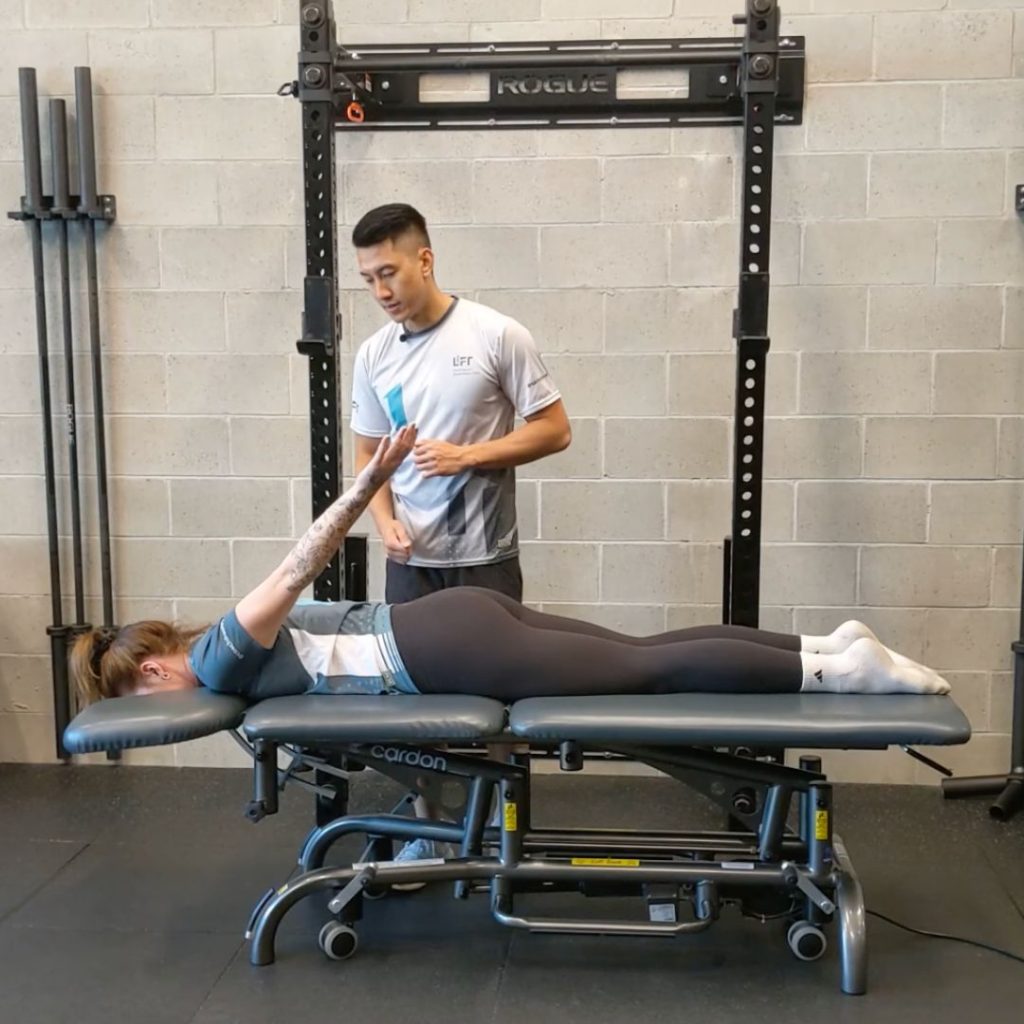 Assessing mobility when moving your arm behind your back Lift Clinic